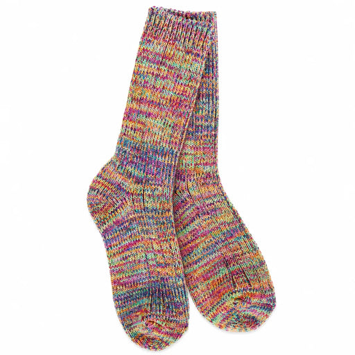 A pair of hand-knit crew socks in a vibrant, multicolored marled yarn blend, displayed against a solid white background.