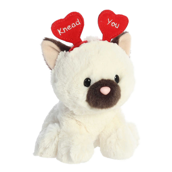 A plush toy with a heart-shaped head and ears, symbolizing love and warmth in its design.
