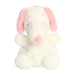  A white stuffed animal with pink ears, sitting upright against a soft background.
