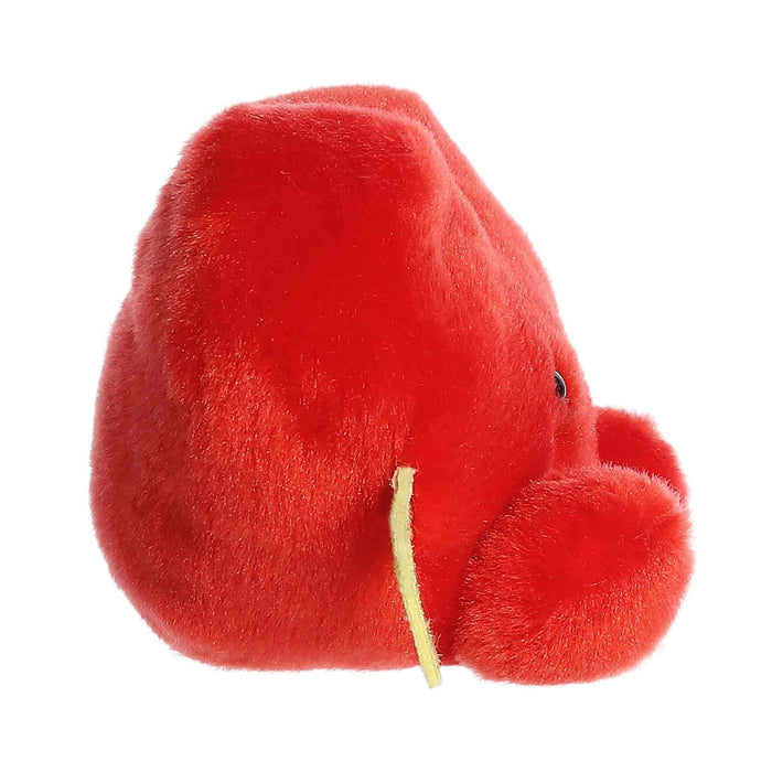 A soft, red heart-shaped plush toy adorned with an arrow, conveying a playful message of love and attraction.
