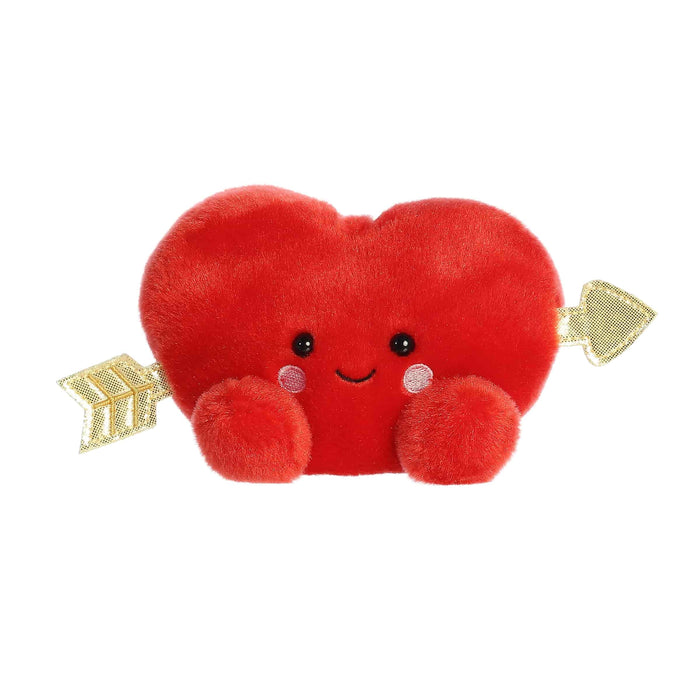 A vibrant red plush toy in the shape of a heart, featuring an arrow piercing through it, representing romantic themes.