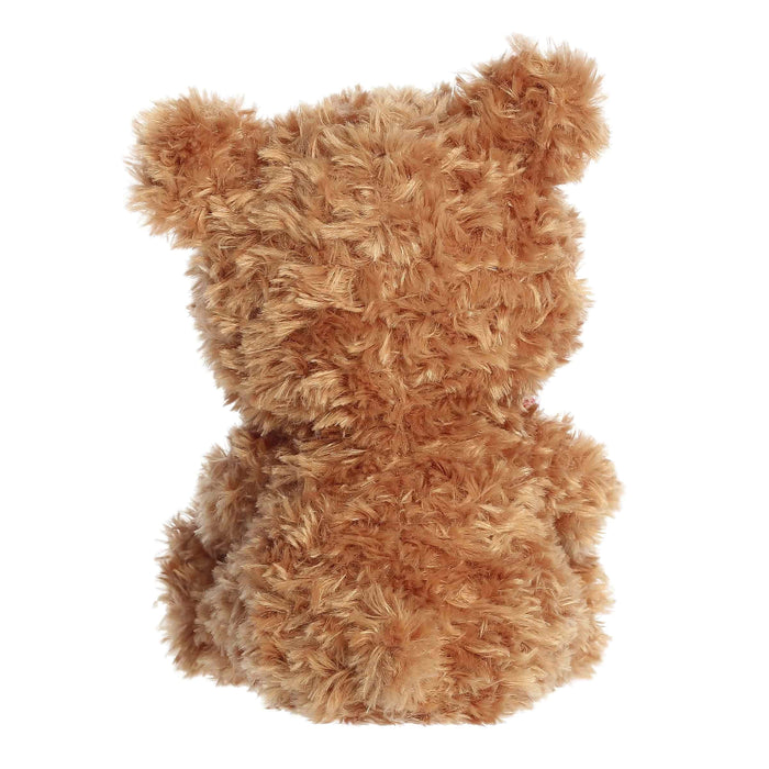  A brown teddy bear adorned with a heart and arrow, signifying love and companionship.