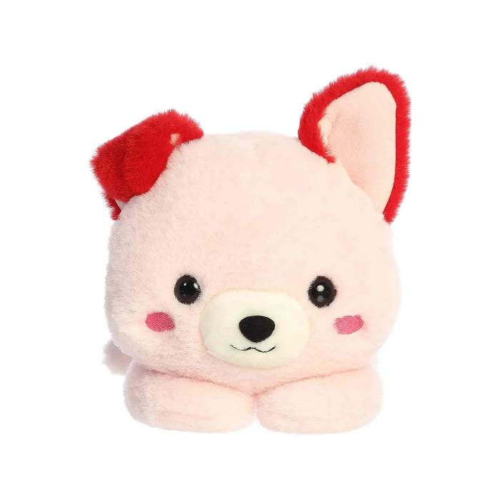 A pink stuffed animal wearing a red collar, sitting upright against a neutral background.