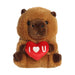 A plush toy embraces a heart-shaped "I love you" sign, symbolizing love and companionship.