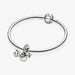 Baby teddy bear dangle charm with a cute and playful design