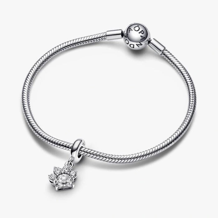 Elevate your love for your best friend with the Sparkling Pet Paw Print Dangle Charm.