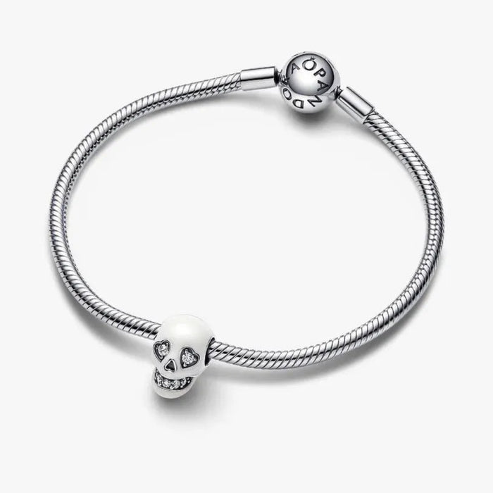 Pandora Glow-in-the-dark Sparkling Skull Charm featuring a detailed skull design with sparkling accents.