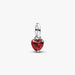 Silver pendant with a red heart-shaped gemstone on a white background