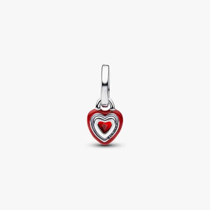 Heart-shaped pendant with red center on a white background