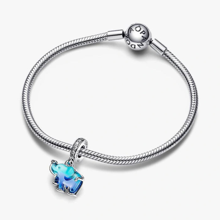 The Blue Murano Glass Elephant Dangle Charm is a colorful ode to a majestic creature.