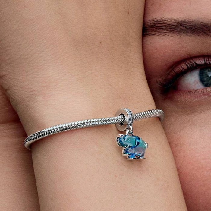 The Blue Murano Glass Elephant Dangle Charm is a colorful ode to a majestic creature.