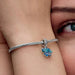 The Blue Murano Glass Elephant Dangle Charm is a colorful ode to a majestic creature.