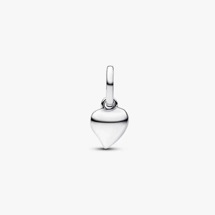 Close‑up of polished sterling silver asymmetric heart charm