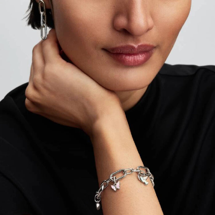 Stunning Pandora butterfly charm embellished with a white opal, highlighting intricate details and artistry.