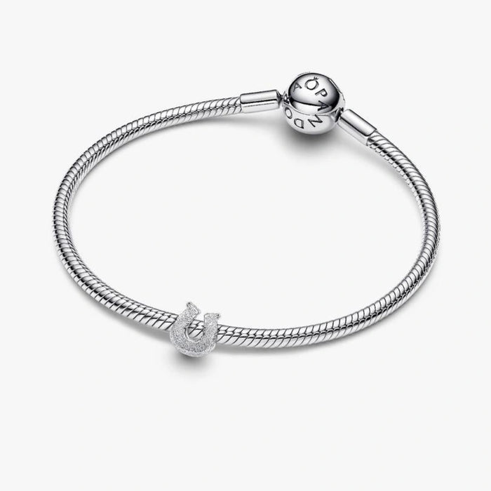 Pandora Textured Horseshoe Mini Charm in sterling silver with a detailed textured finish.