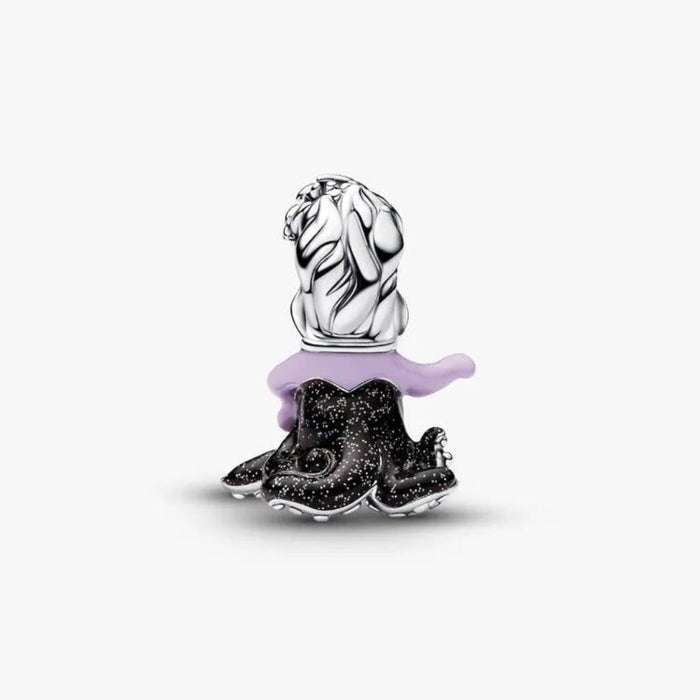 Silver charm with black and purple accents on a white background