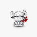 Silver crab charm with red detail on a white background