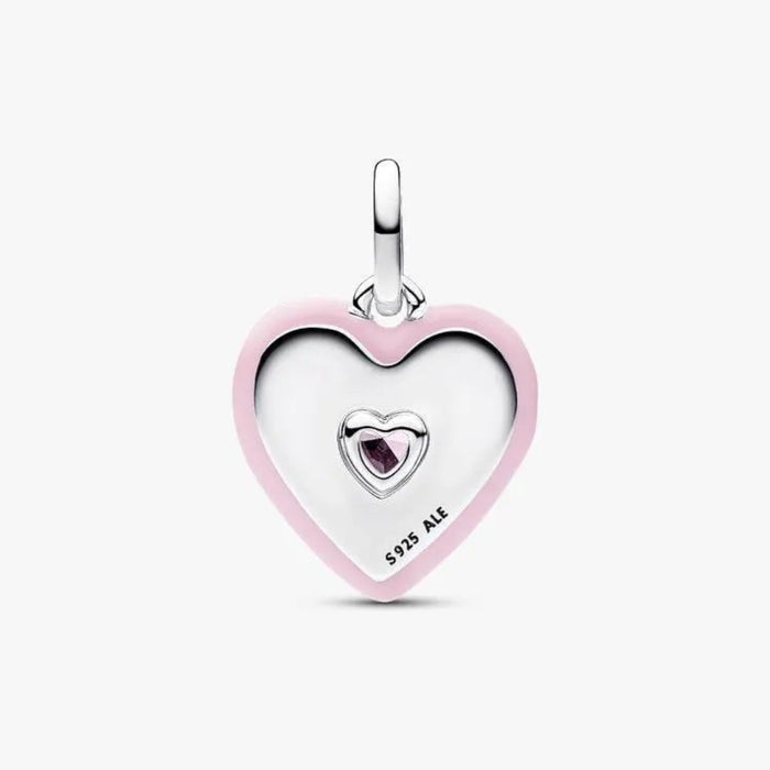 Heart-shaped pendant with pink border and embedded gemstone on a white background