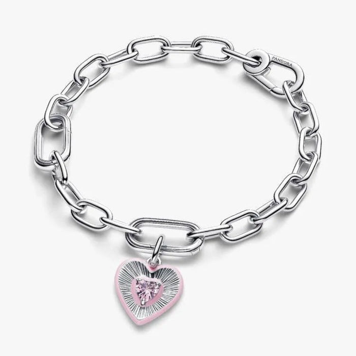 Silver chain bracelet with a pink heart-shaped charm on a white background