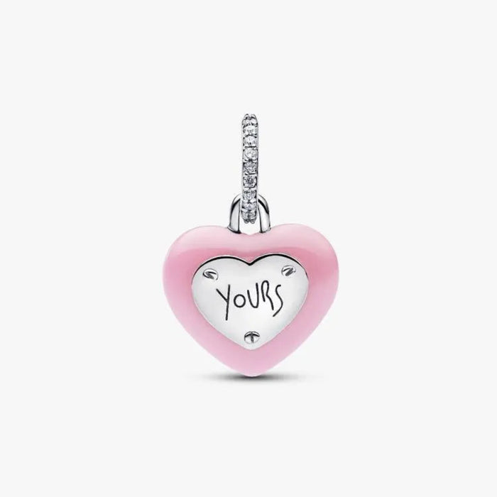 Heart-shaped pendant with 'Yours' engraving on a white background