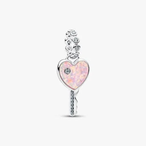 Heart-shaped key charm with pink opal and clear gemstones on a white background