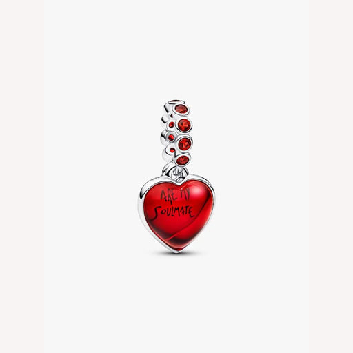 Heart-shaped pendant with red stone accents on a light background