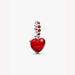Heart-shaped pendant with red stone accents on a light background