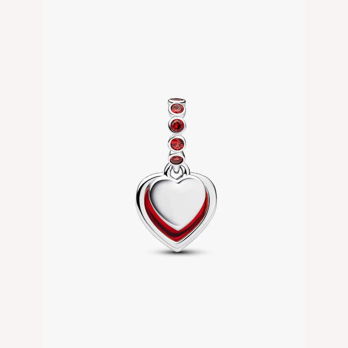 Heart-shaped charm with red accents on a light background