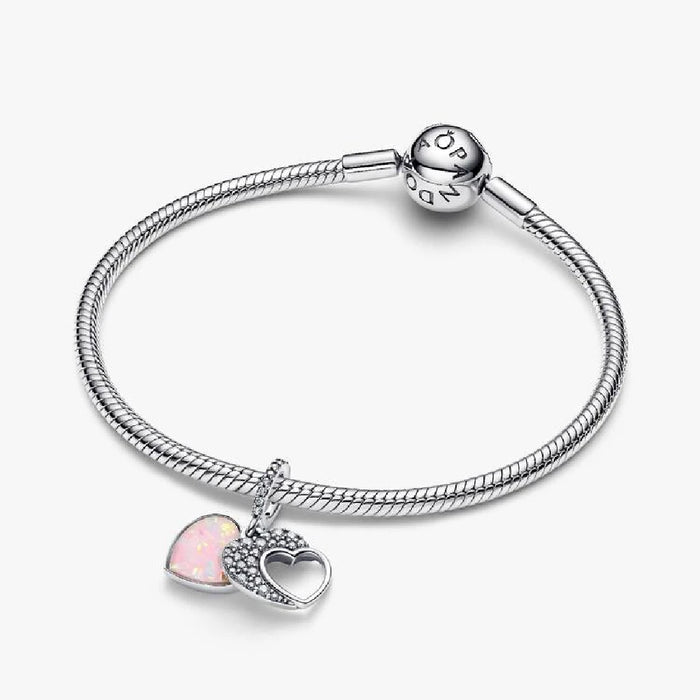Elegant Pandora heart charm embellished with pink opal stones, perfect for adding a touch of color to any jewelry collection.