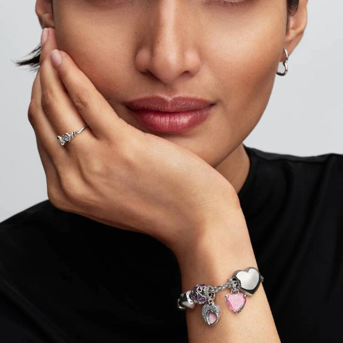 Charming Pandora heart design with pink opal stones, offering a lovely and vibrant addition to your jewelry ensemble.