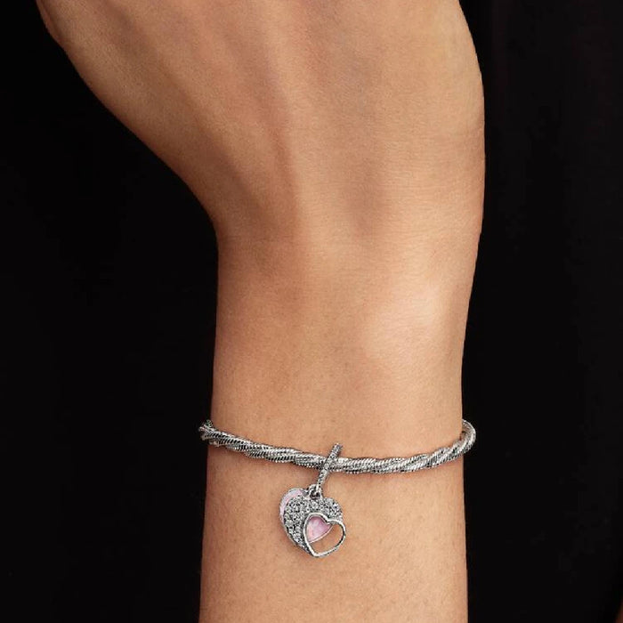 Delicate Pandora heart charm set with pink opal stones, combining beauty and elegance in a unique accessory.