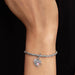 Delicate Pandora heart charm set with pink opal stones, combining beauty and elegance in a unique accessory.
