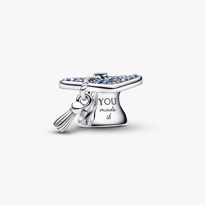 Silver graduation cap charm on a light background