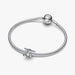 Silver graduation cap charm on a light background