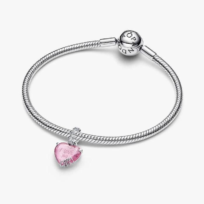 Heart-shaped pink charm displaying the words "I love you," representing love and sentiment.