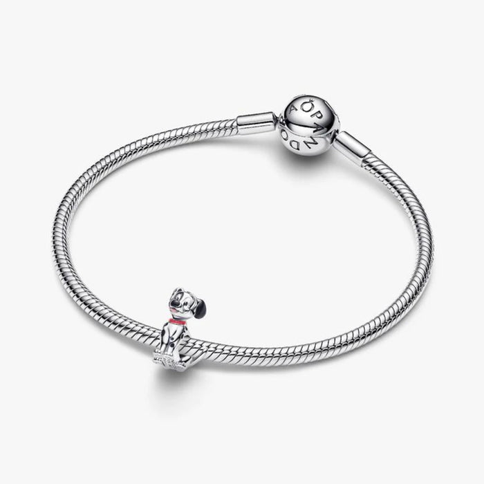  A charming black and white dog pendant with a sleek design.