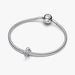 Silver bracelet with a tulip shaped charm on a light background