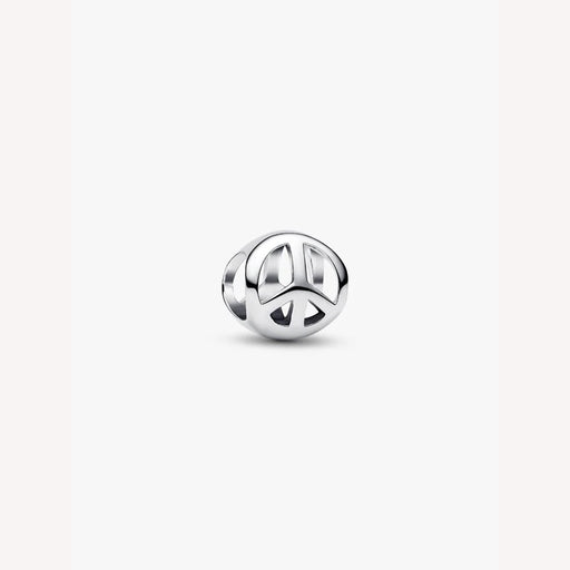Silver peace symbol charm on a light background