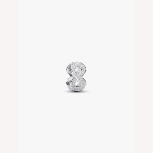 Silver number 8 charm on a white background