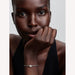 Woman wearing a bracelet with a white background
