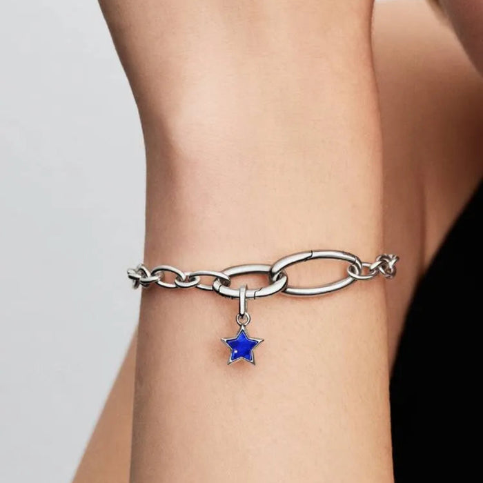 PANDORA Blue Star Mini Dangle Charm in sterling silver with a shimmering textured finish, designed as a delicate celestial star charm for PANDORA Moments bracelets and necklaces.