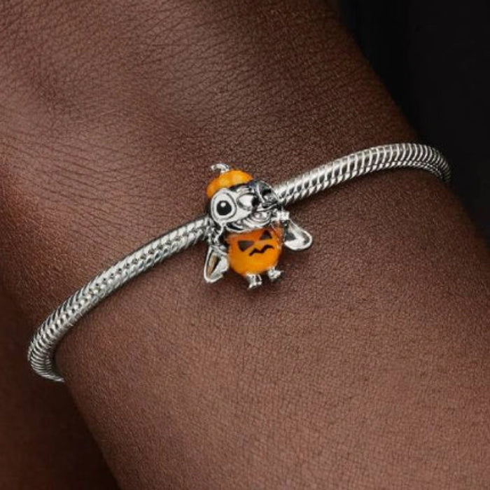 Pandora Disney Halloween Pumpkin Stitch charm featuring Stitch in a festive pumpkin-inspired design, crafted for Pandora Moments bracelets and necklaces.