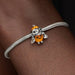 Pandora Disney Halloween Pumpkin Stitch charm featuring Stitch in a festive pumpkin-inspired design, crafted for Pandora Moments bracelets and necklaces.