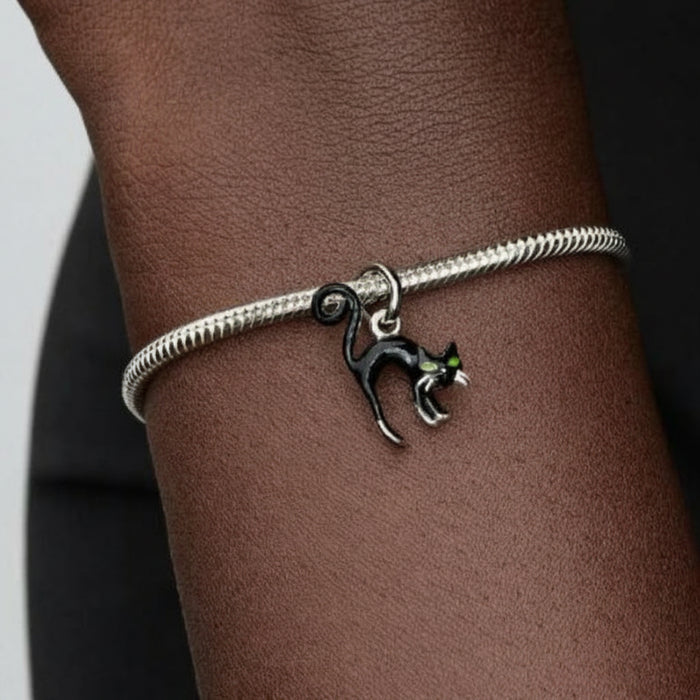 Pandora Black Cat dangle charm featuring an intricately detailed black cat with a polished finish, designed for PANDORA Moments bracelets and necklaces.