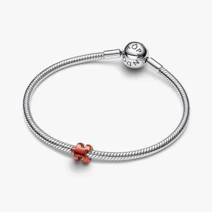 Orange Puzzle Piece Mini Charm featuring a vibrant puzzle piece