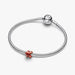 Orange Puzzle Piece Mini Charm featuring a vibrant puzzle piece
