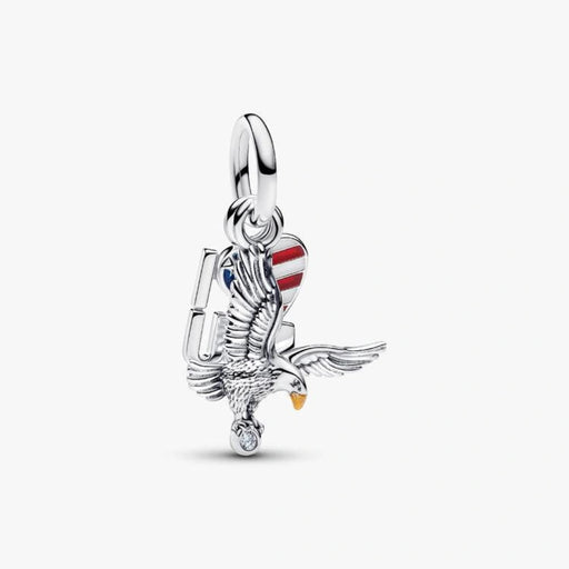 Sterling silver-tone dangle charm featuring a detailed eagle, an American flag heart with red, white, and blue enamel, and a sparkling crystal accent for charm bracelets and necklaces.