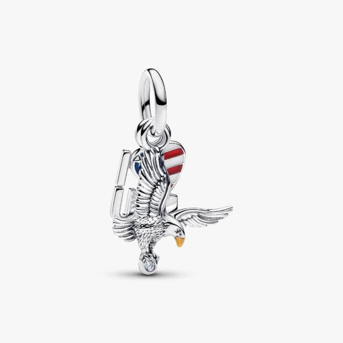 Sterling silver-tone dangle charm featuring a detailed eagle, an American flag heart with red, white, and blue enamel, and a sparkling crystal accent for charm bracelets and necklaces.