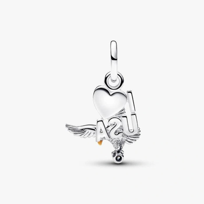 Sterling silver-tone dangle charm featuring a detailed eagle, an American flag heart with red, white, and blue enamel, and a sparkling crystal accent for charm bracelets and necklaces.