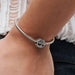Sterling silver Pandora Family Tree Charm featuring a sculpted tree with branches representing family connections.